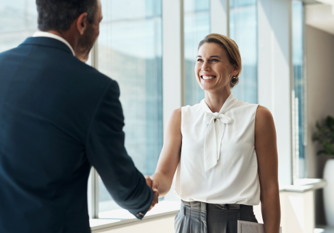 man and woman shaking hands