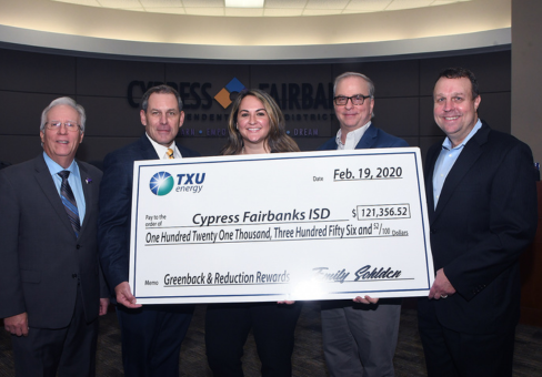 members of Cypress Fairbanks ISD holding a large check