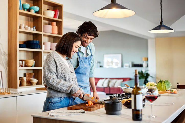 Couple cooking in kitchen