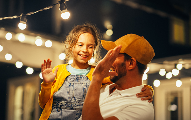 Man and girl giving high five