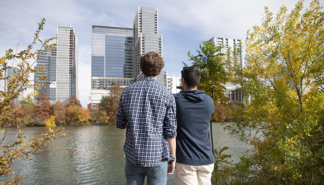 Two men looking at a Austin, Texas skyline