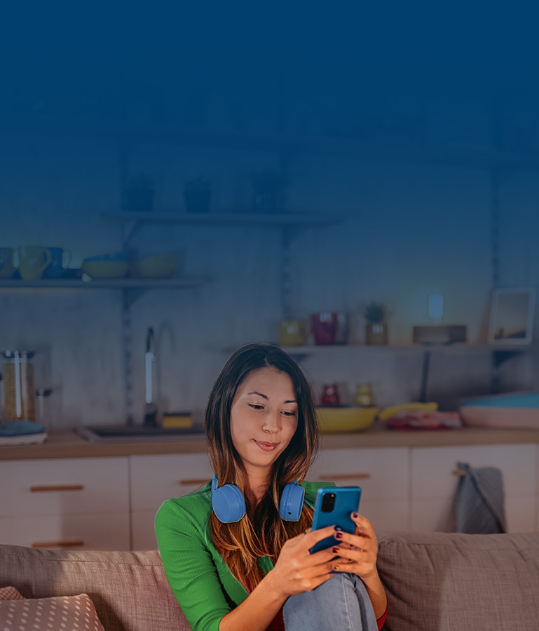 Woman with phone and headphones