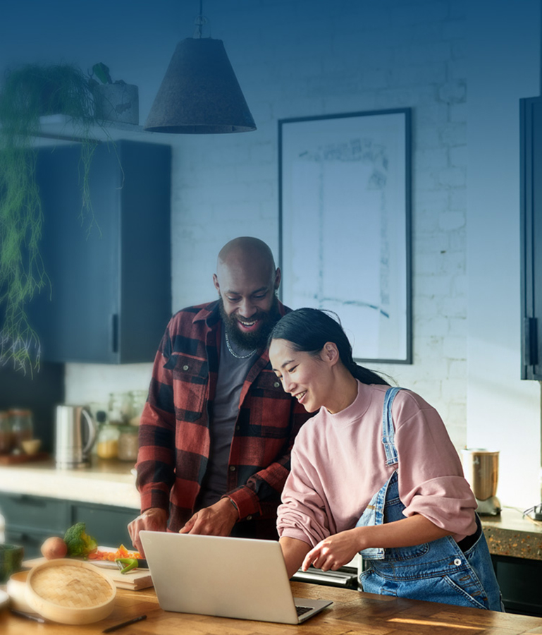 Couple in kitchen cooking